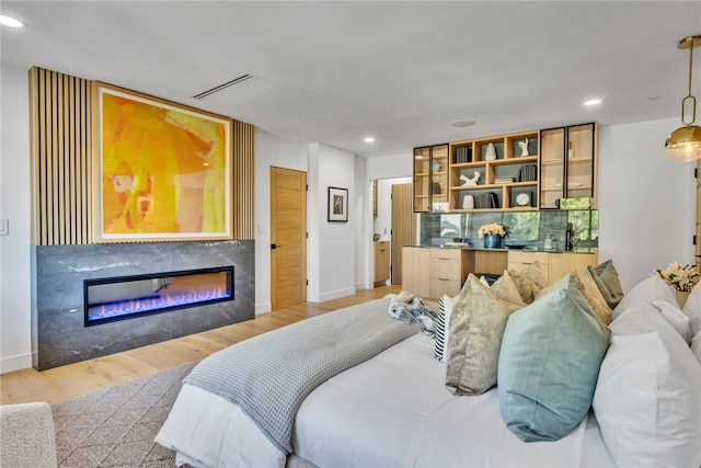 bedroom featuring light hardwood / wood-style floors