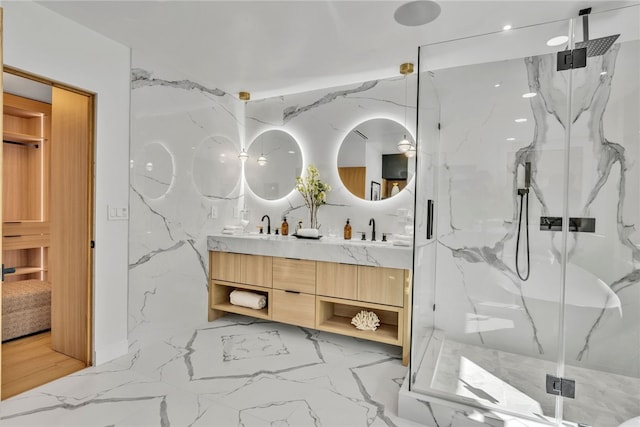 bathroom featuring vanity and an enclosed shower