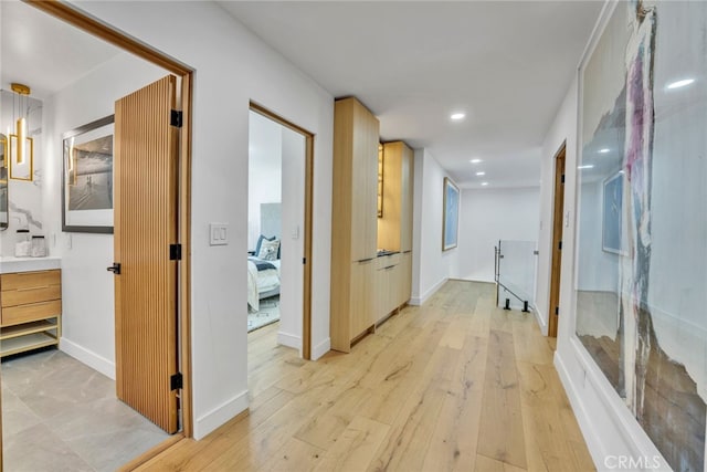 hallway featuring light hardwood / wood-style flooring