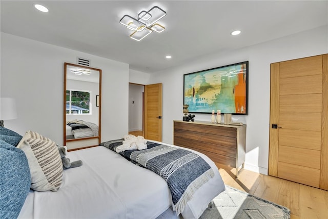 bedroom with light hardwood / wood-style flooring