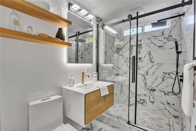 bathroom with vanity, toilet, and a shower with shower door