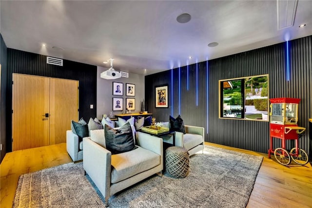 home theater room featuring hardwood / wood-style flooring