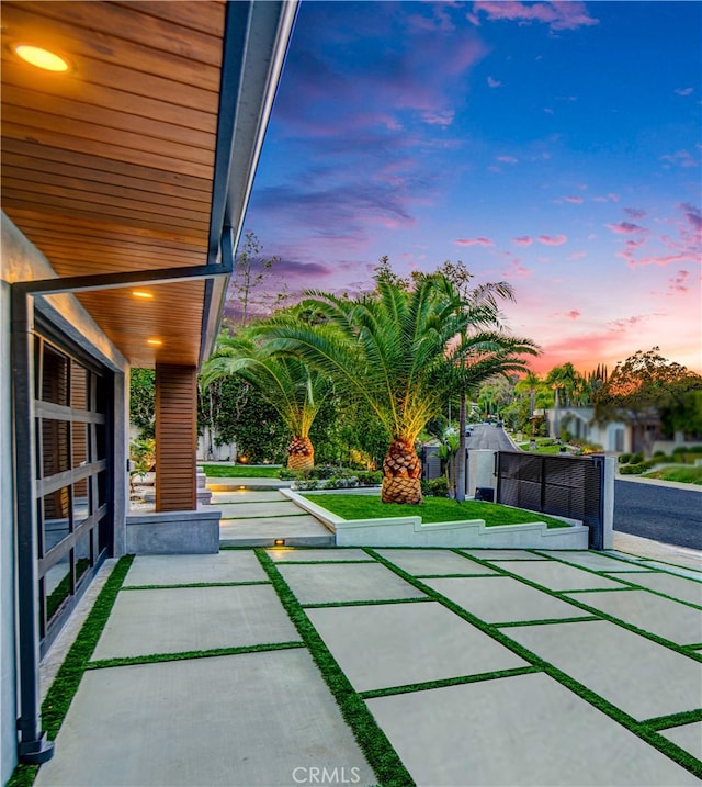 view of patio terrace at dusk