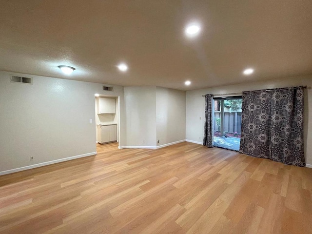 basement featuring light hardwood / wood-style floors