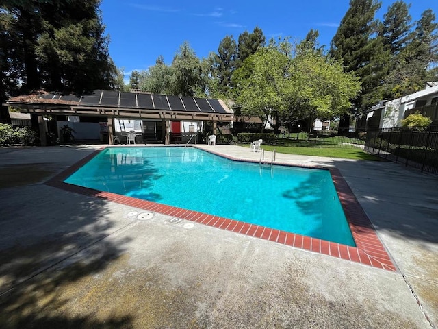 view of swimming pool featuring a patio area