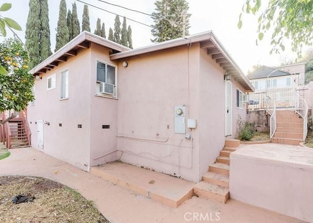 view of side of home featuring a patio