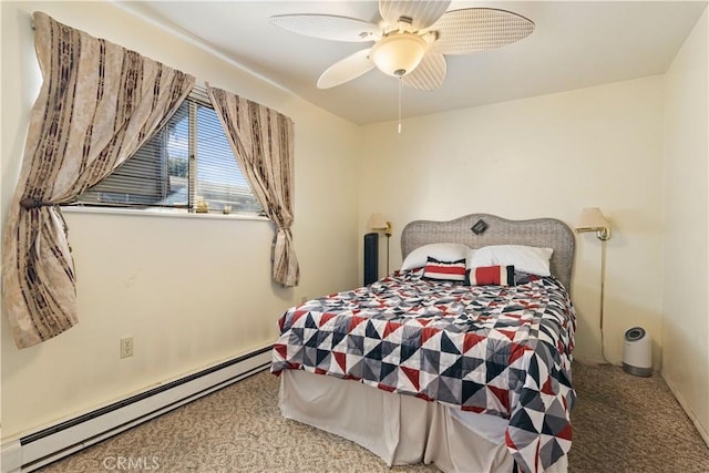 carpeted bedroom featuring baseboard heating and ceiling fan