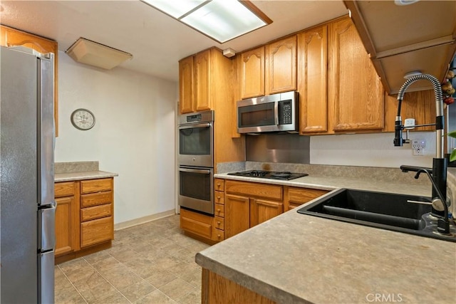 kitchen featuring appliances with stainless steel finishes and sink