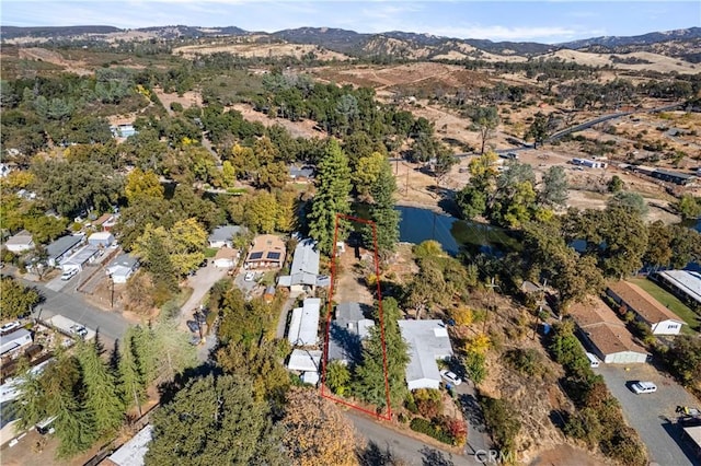 birds eye view of property featuring a mountain view