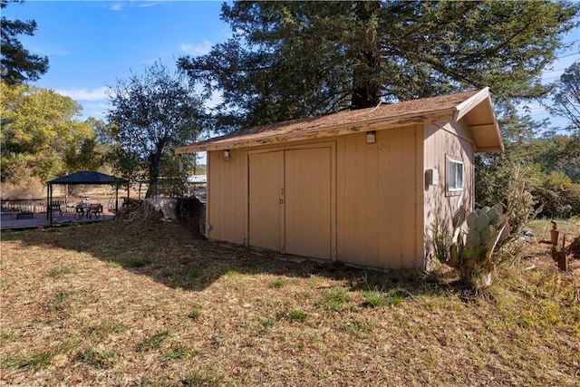 view of outbuilding featuring a gazebo and a lawn