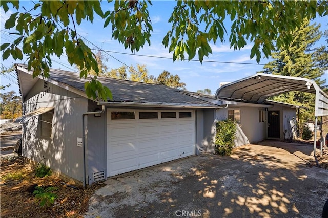 garage featuring a carport