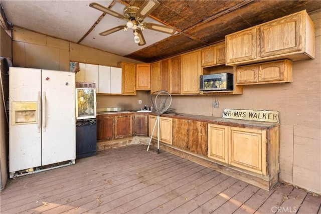 kitchen with lofted ceiling, ceiling fan, light wood-type flooring, and white appliances