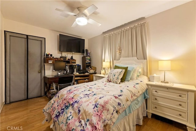 bedroom featuring ceiling fan and light hardwood / wood-style flooring