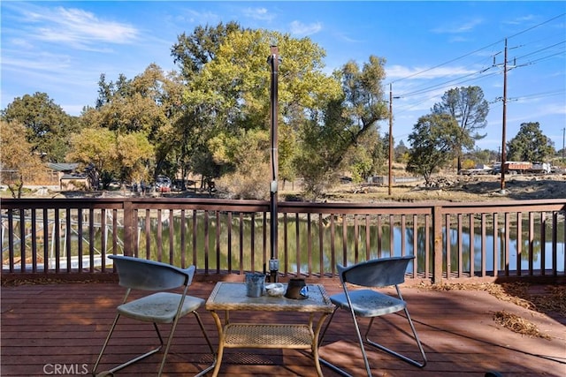 deck featuring a water view