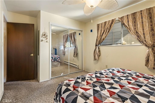 carpeted bedroom featuring ceiling fan, baseboard heating, and a closet