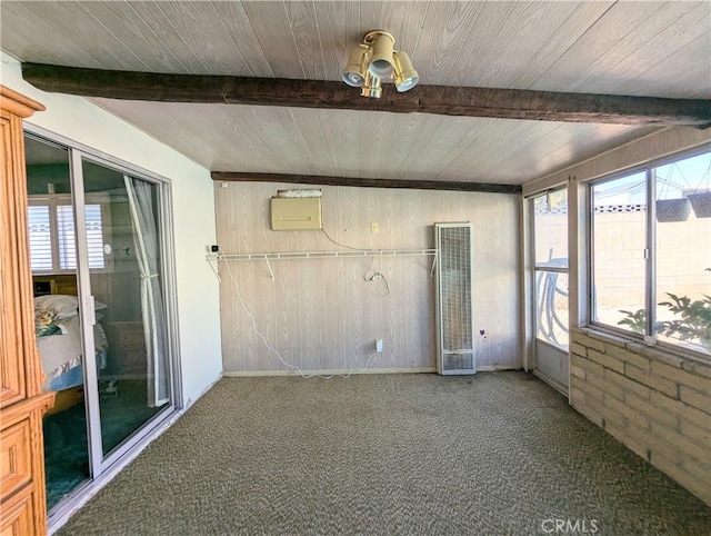 unfurnished sunroom featuring beam ceiling and wooden ceiling