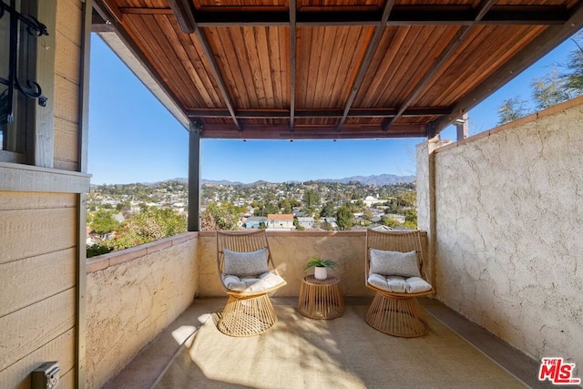 balcony featuring a mountain view