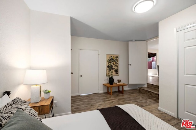 bedroom featuring dark hardwood / wood-style flooring