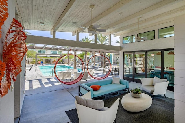 interior space featuring ceiling fan and a pool