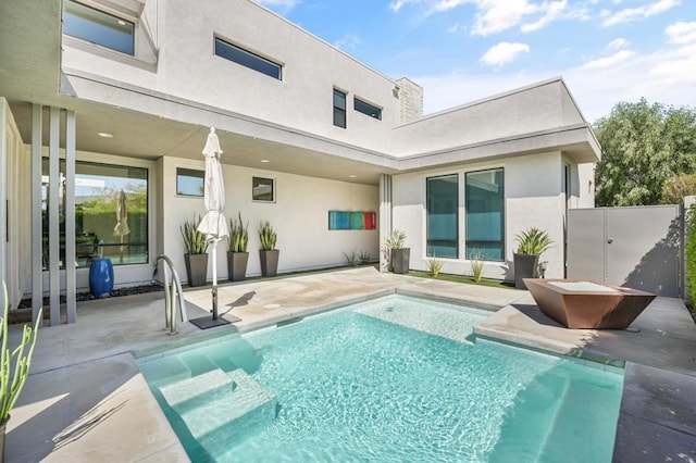 view of swimming pool with a patio