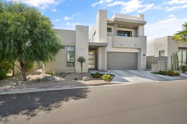 contemporary house with a balcony and a garage