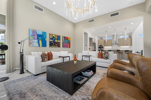 tiled living room featuring a notable chandelier