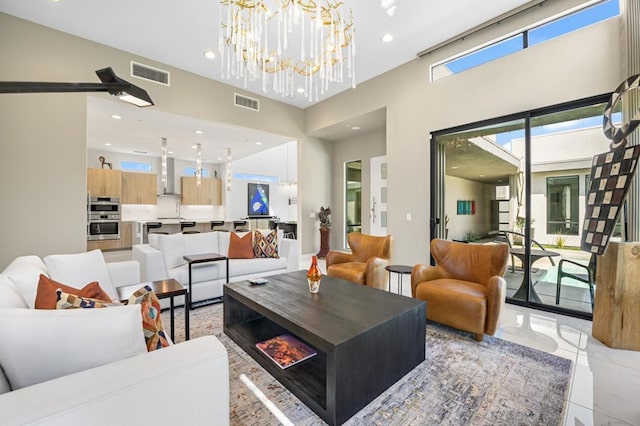 living room with a wealth of natural light and a notable chandelier