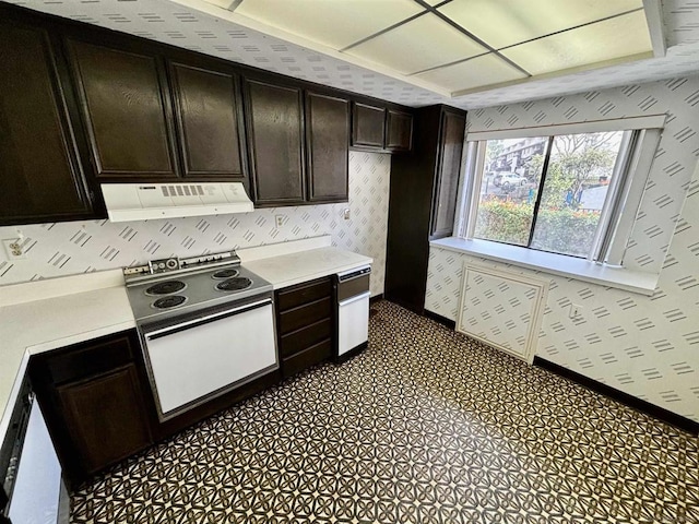 kitchen featuring white range with electric stovetop, dark brown cabinetry, and exhaust hood