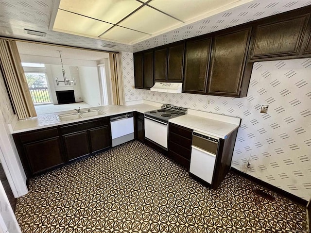 kitchen featuring dark brown cabinetry, electric range, sink, hanging light fixtures, and white dishwasher