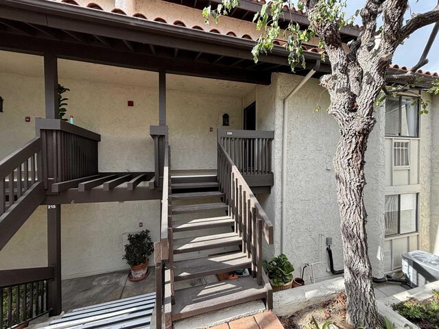 doorway to property with central AC