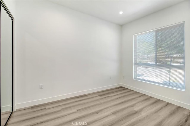 spare room with light wood-type flooring