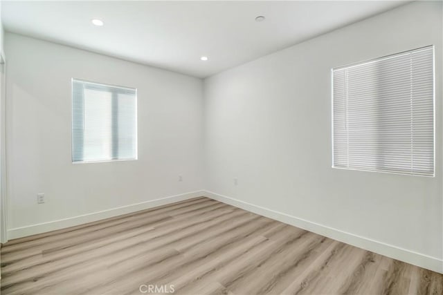 unfurnished room featuring light wood-type flooring