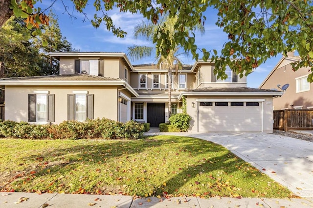 view of front of property featuring a front lawn and a garage