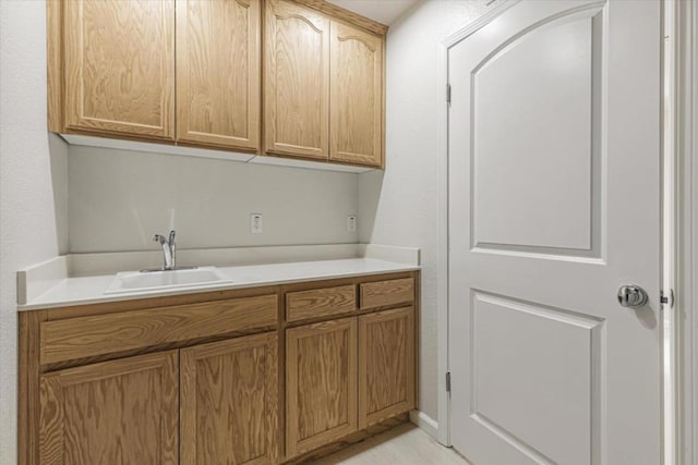 laundry area featuring sink