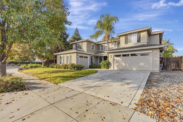 front facade featuring a front yard and a garage