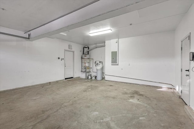 garage with electric panel and water heater