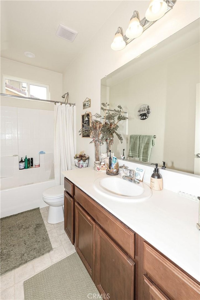 full bathroom featuring tile patterned flooring, vanity, toilet, and shower / bath combo with shower curtain