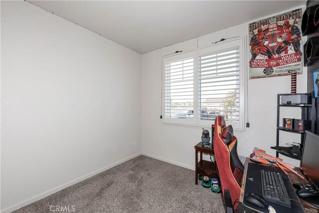 unfurnished office featuring a wealth of natural light and carpet