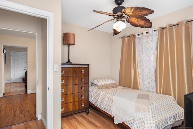 bedroom with hardwood / wood-style flooring and ceiling fan