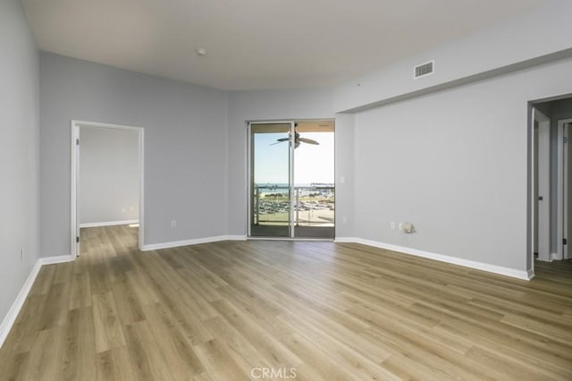 spare room with light wood-type flooring