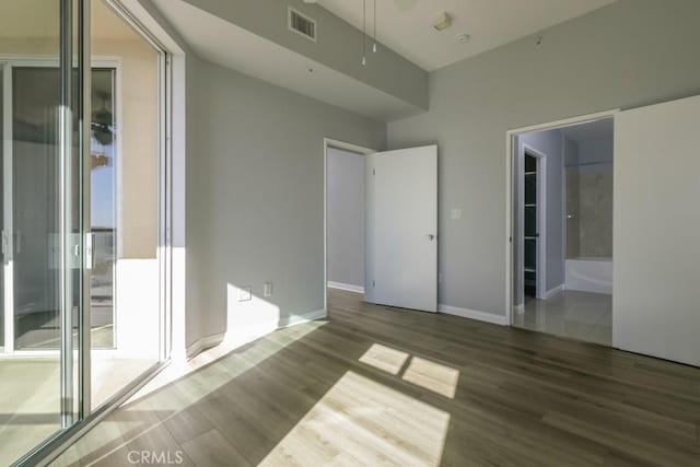 empty room featuring wood-type flooring