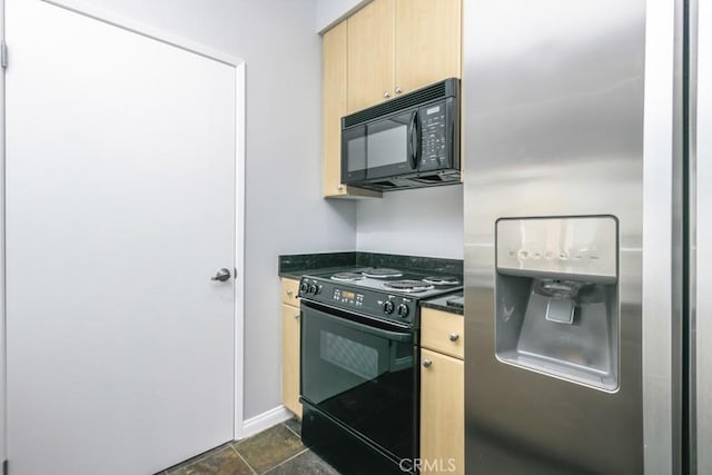 kitchen featuring light brown cabinetry, black appliances, and dark stone counters