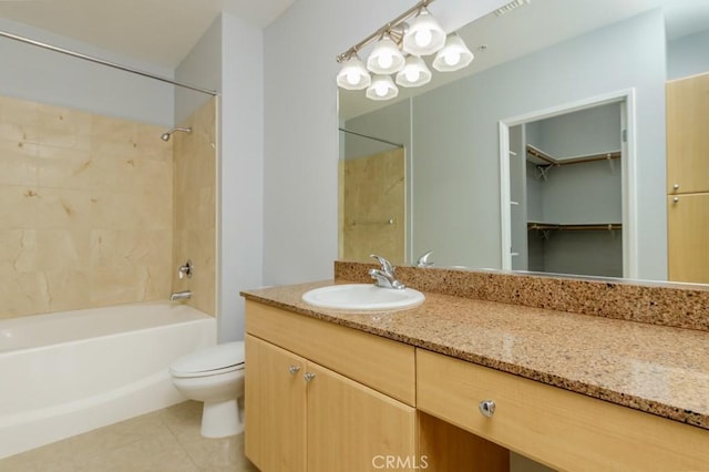 full bathroom featuring tile patterned flooring, toilet, vanity, and bathing tub / shower combination