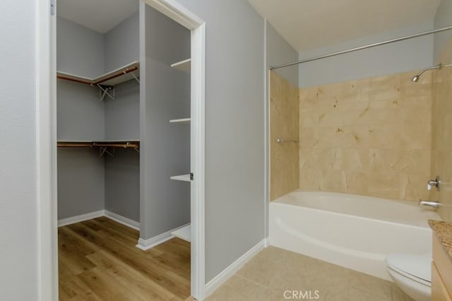 full bathroom featuring shower / washtub combination, toilet, and vanity