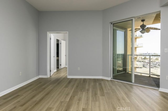 empty room featuring ceiling fan and wood-type flooring