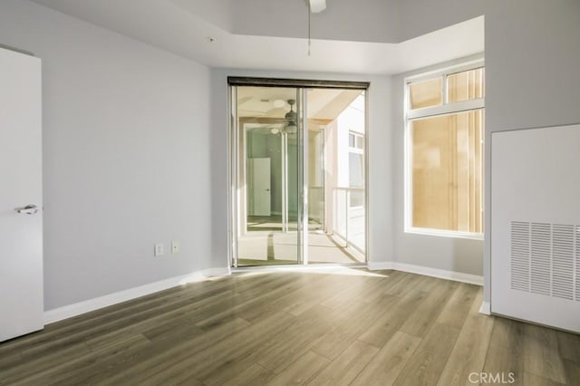 empty room with wood-type flooring