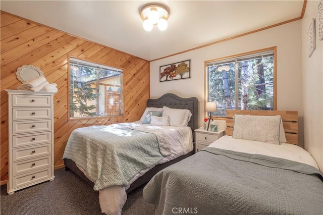 bedroom featuring crown molding and wood walls