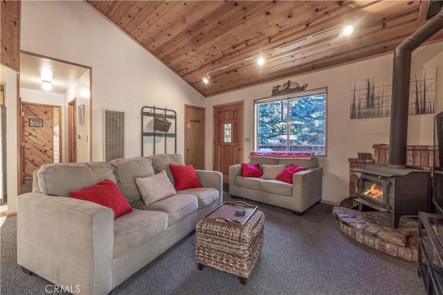 living room with carpet floors, high vaulted ceiling, a wood stove, and wood ceiling