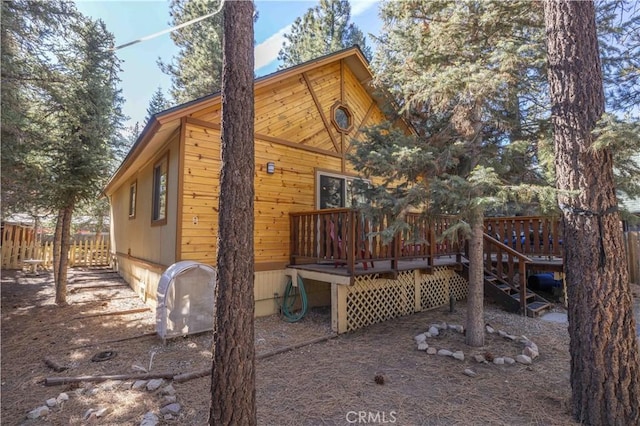 exterior space featuring a wooden deck