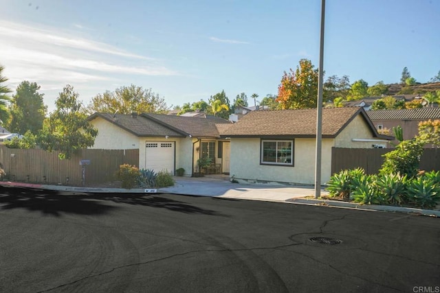 ranch-style house featuring a garage